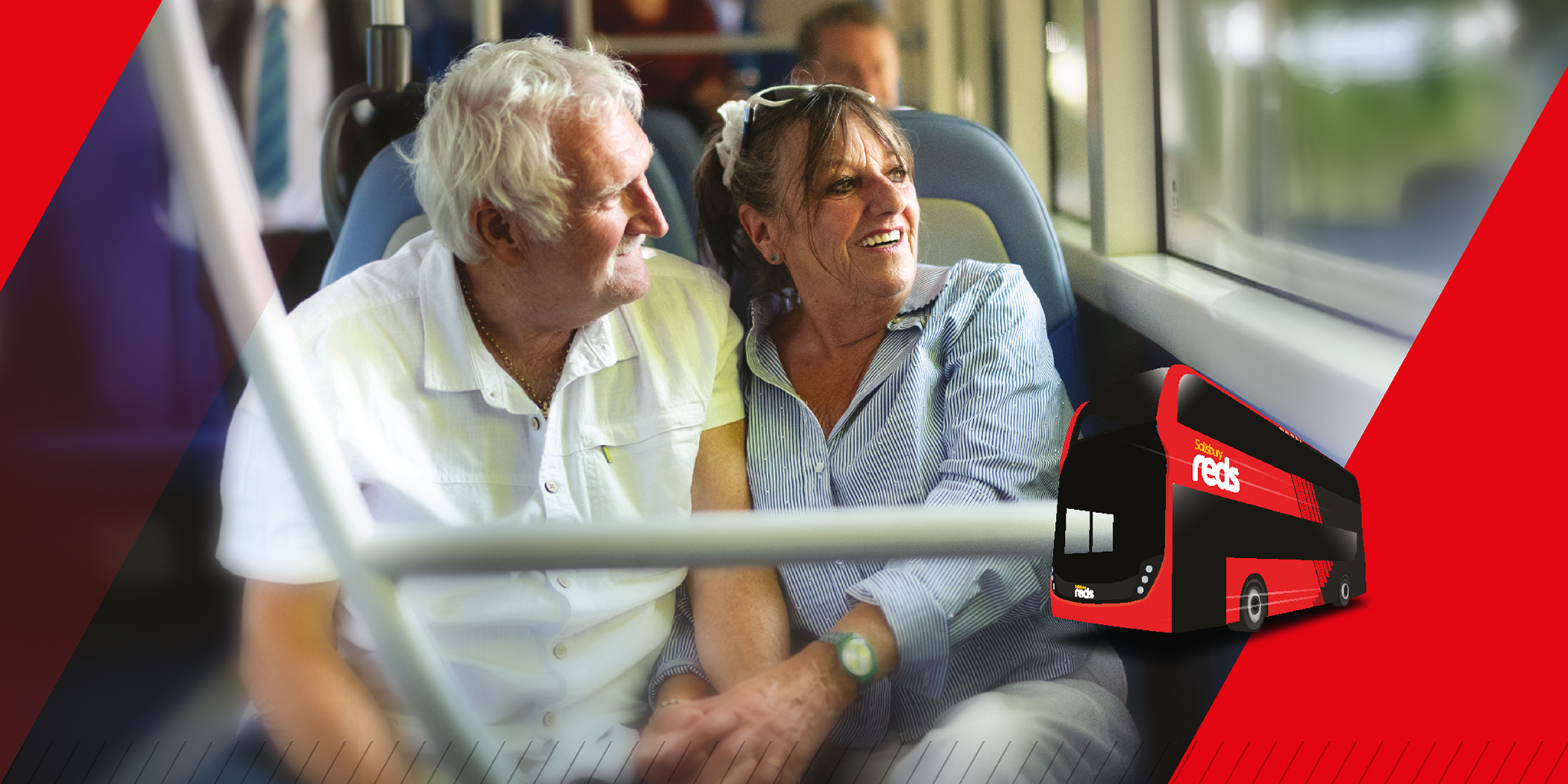 older couple on a bus looking out the window